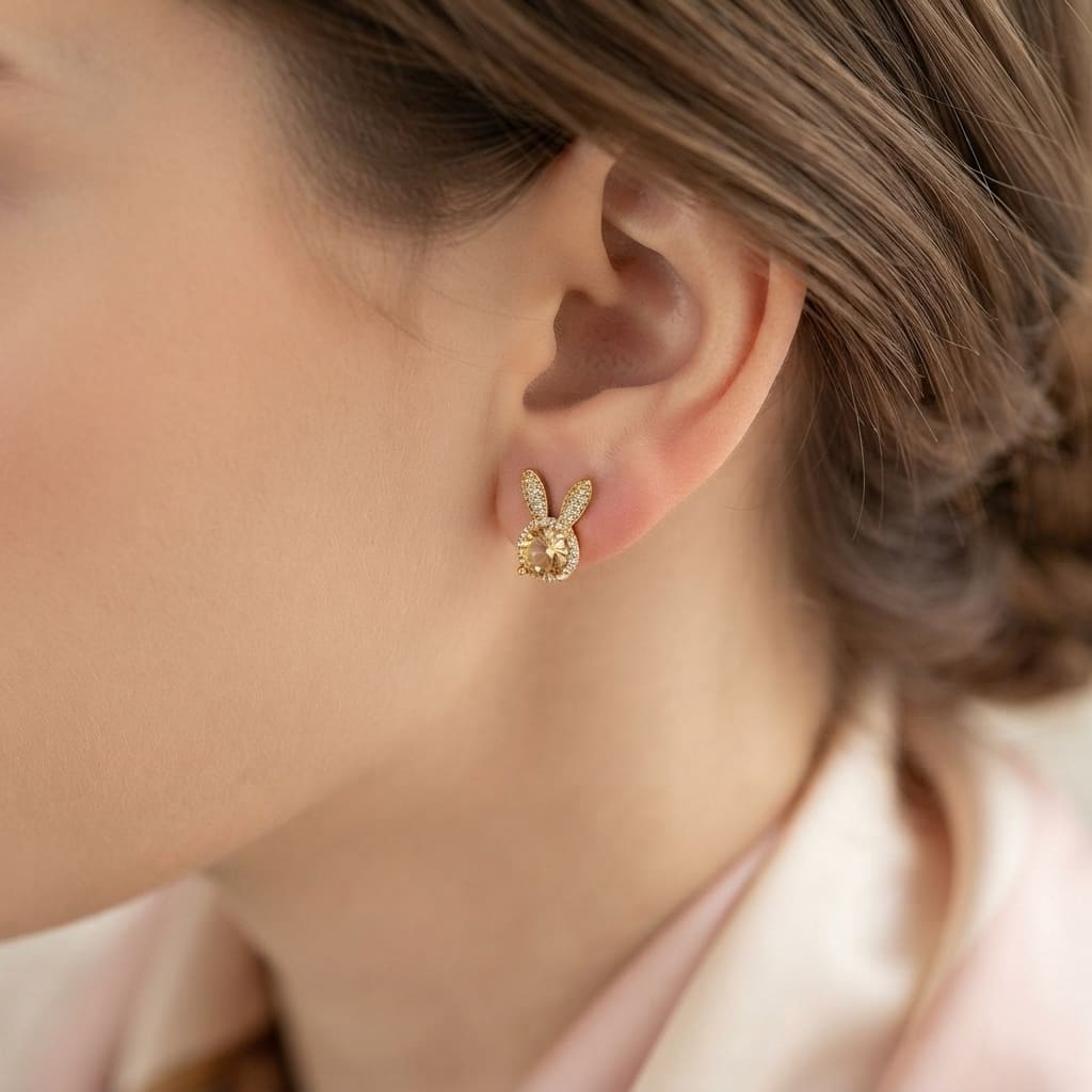 gold bunny ear stud earring with a champagne oval center stone and sparkling crystal ears - Snap Mart Pakistan