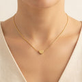 Delicate gold snake chain necklace featuring a small polished heart pendant worn around a model's neck - Snap Mart Pakistan