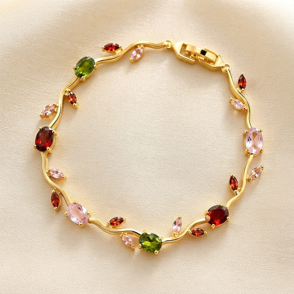Gold wave-style tulip leaf bracelet with oval and marquise crystals in pink, green, and red on beige fabric - Snap Mart Pakistan