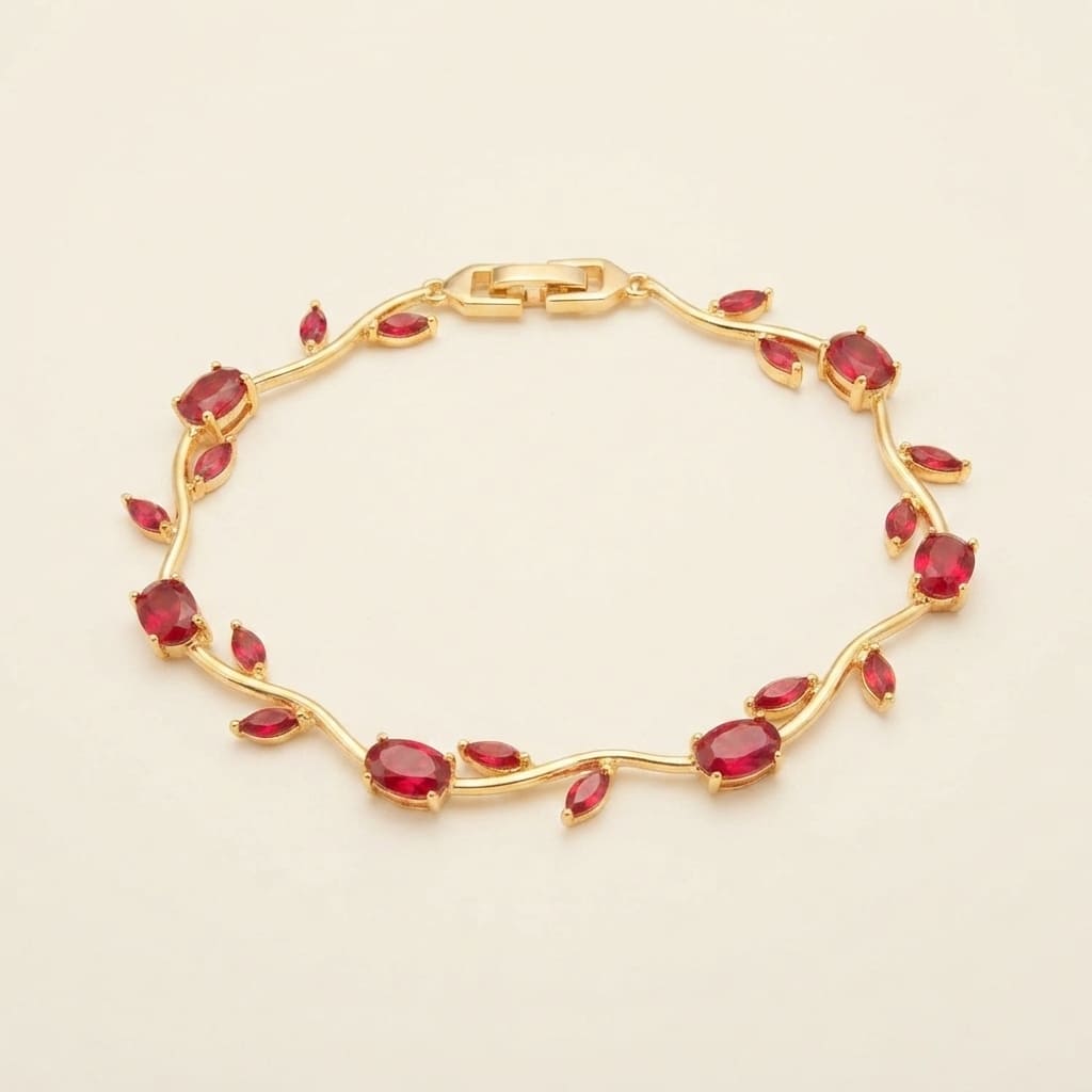 Gold vine-style tulip leaf bracelet with oval and marquise red crystals on light beige background - Snap Mart Pakistan