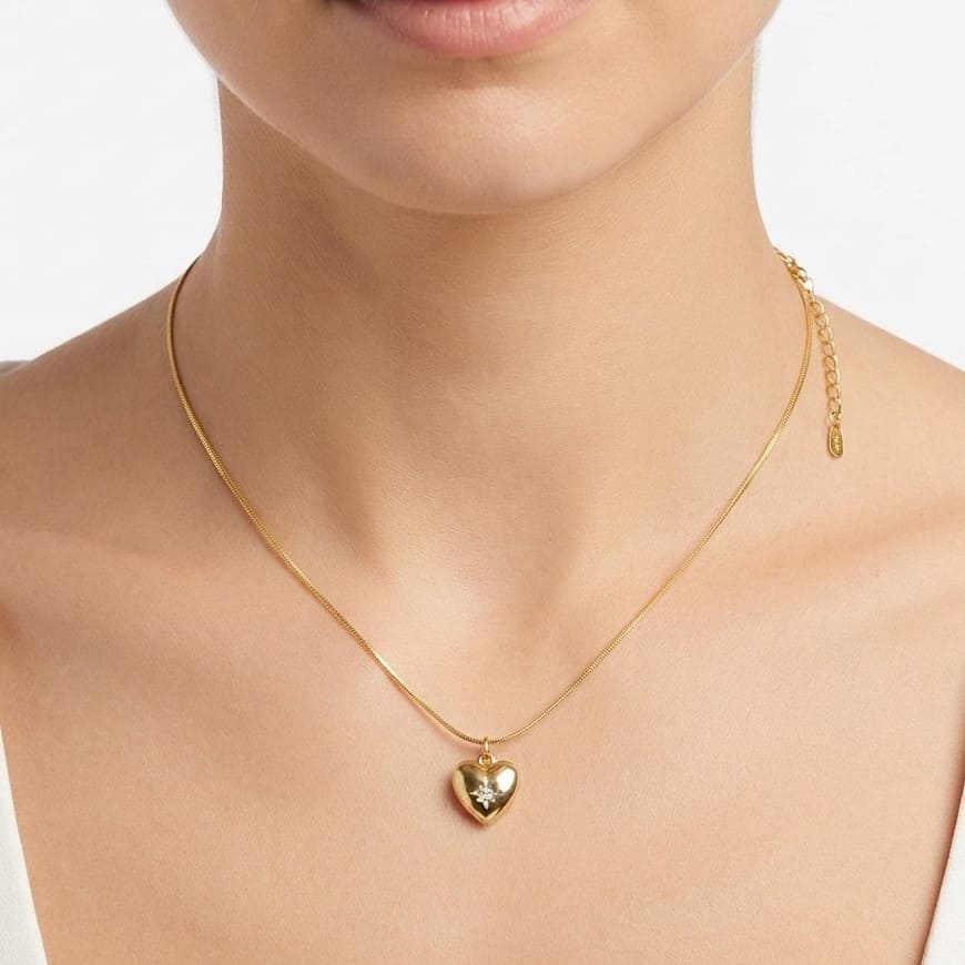 Golden heart pendant necklace with sparkle stone worn by model close-up - Snap Mart Jewelry Pakistan