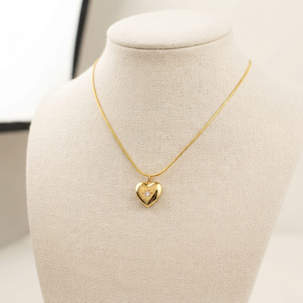 Golden heart pendant necklace with sparkle stone on cream jewelry bust - Snap Mart Jewelry Pakistan