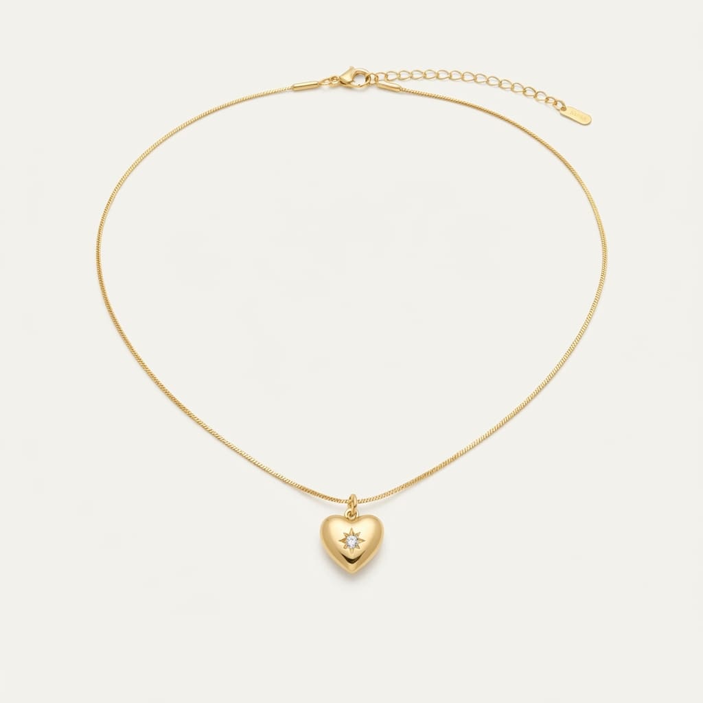 Golden heart pendant necklace with starburst stone on chain layout - Snap Mart Jewelry Pakistan