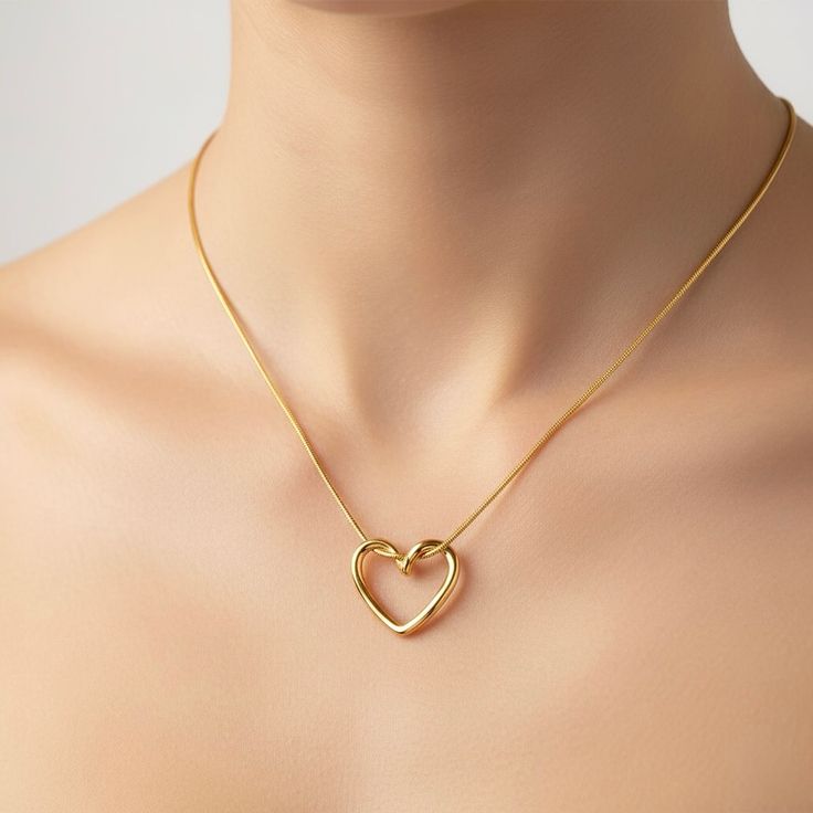 Twisted gold open heart pendant necklace on snake chain worn by model - Snap Mart Jewelry Pakistan