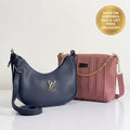 Navy blue curved shoulder bag and pink pleated crossbody purse duo bundle on white studio background with free shipping badge